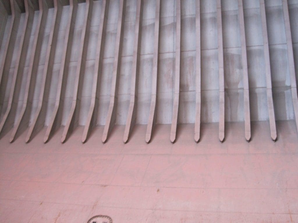 Corrosion protection of cargo holds on board iron ore carriers